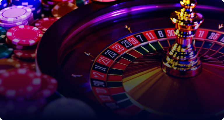 A detailed shot of a glowing Multicasino roulette wheel at night